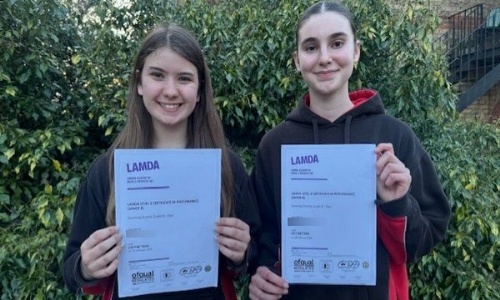students holding certificate